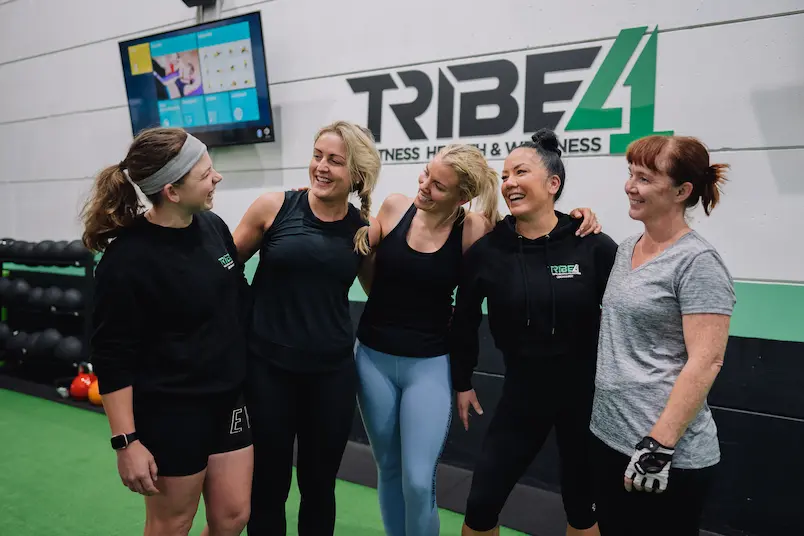 Tribe41 members laughing together in studio